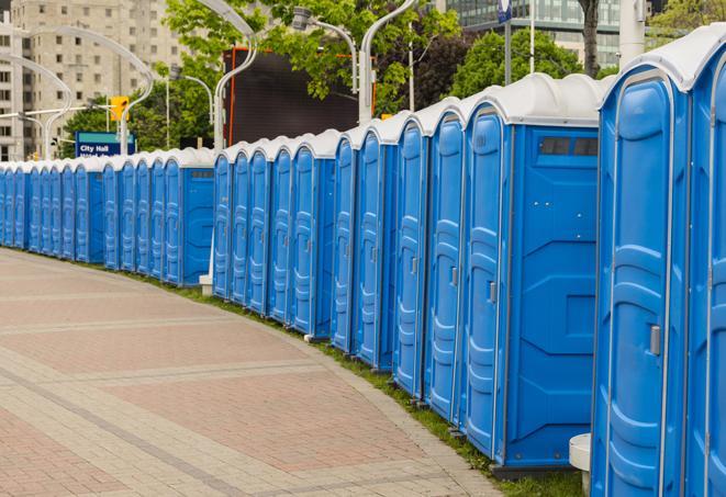 hygienic portable restrooms lined up at a beach party, ensuring guests have access to the necessary facilities while enjoying the sun and sand in Boyers